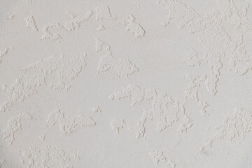 Abstract textured background. Close up view of concrete wall  covered with gray plaster. Copy space for your text.