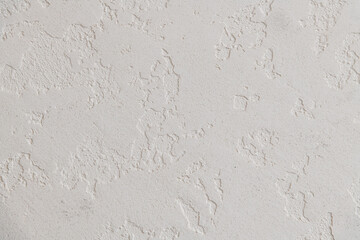Abstract textured background. Close up view of concrete wall  covered with gray plaster. Copy space for your text.