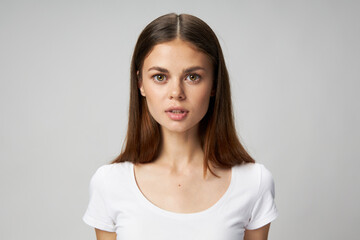 Woman with long hair in white t-shirt cropped view 