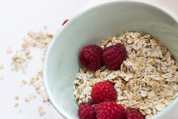 healthy Breakfast oatmeal porridge and fruit berries on a white background