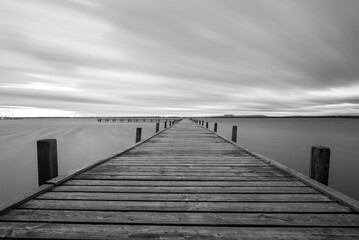 wooden pier with clouds