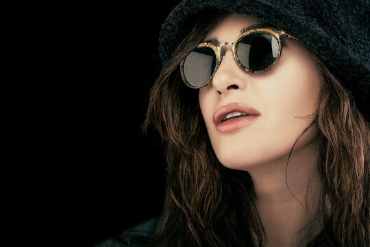 Beautiful young woman wearing trendy sunglasses