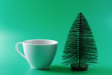 Green background with Christmas tree. Christmas background concept