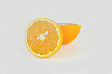 two halves of an orange on a white background