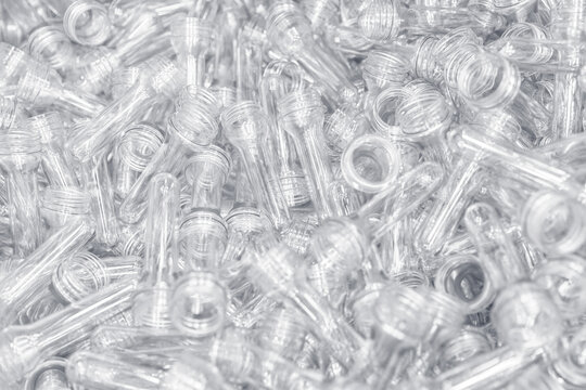 Preforms for making PET plastic bottles. Raw material Line factory manufacturing industrial