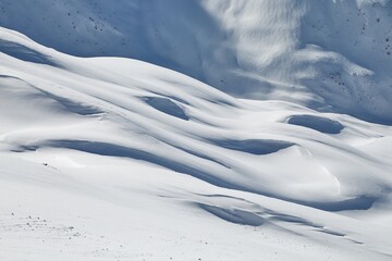 Fototapeta na wymiar Snowy mountains in winter sunlight