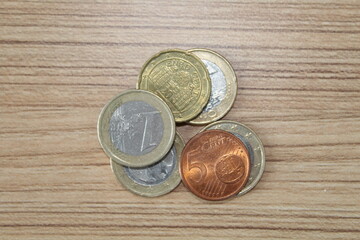 euro coins on a wooden background