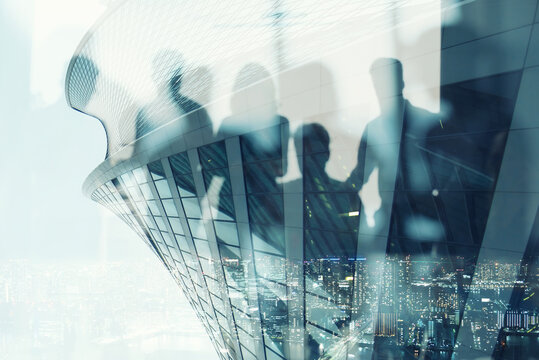 Silhouette of business people work together in office. Concept of teamwork and partnership. double exposure effects