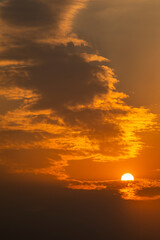 Fototapeta premium golden orange clouds at sunset background