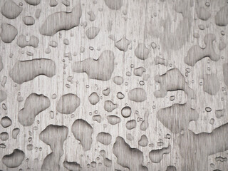 Transparent water droplets on a rough steel surface