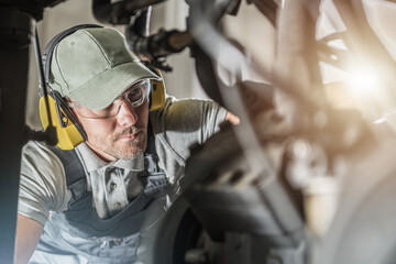 Automotive Industry Technician Looking Into Engine Compartment