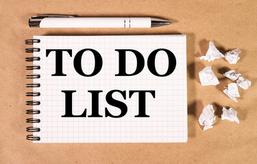 to do list, text on white notepad paper on craft paper background