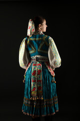 Slovak folklore. Traditional costume. Beautiful girl in traditional dress.