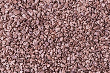 heap of small bronze nuggets background