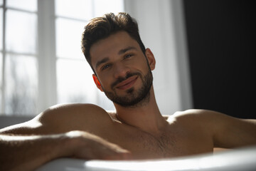 Portrait of bearded man taking bath