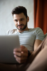 Close up shot of handsome man using laptop