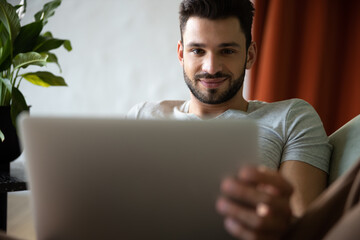 Top view of handsome man using laptop