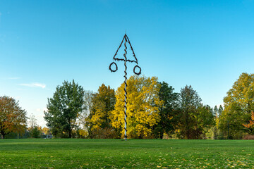 Midsummer pole standing among autumn colored trees