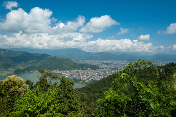 Aerial view of the Lakeside area in Pokhara city, Nepal, with the surrounding hills and Phewa Lake