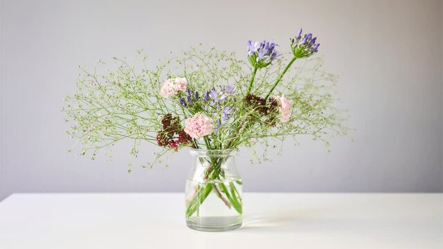 Stop motion. Bouquet 006, step by step installation of flowers in a vase. Flowers bunch, set for home. Fresh cut flowers for decoration home. European floral shop. Delivery fresh cut flower.
