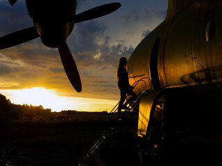 old Soviet military airplane, sunset time. Abandoned Historic Aircraft. Close up of propeller...