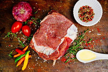 Raw chicken, pork and beef seasoned with spices and vegetables