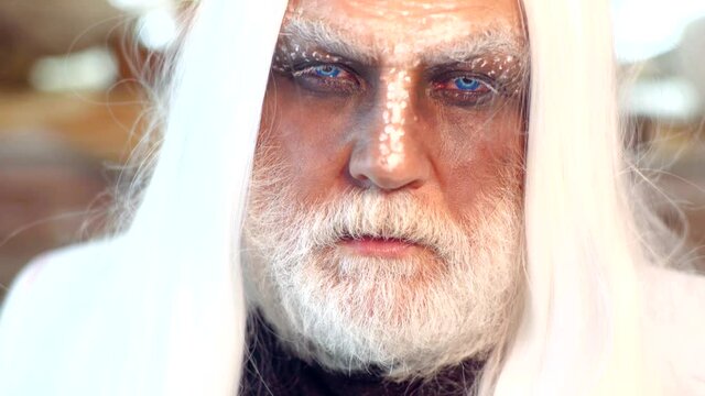 Close up face of witcher scary man. Magic and witchcraft with spell and incantation. Witchery. Magical skills. Evil old man