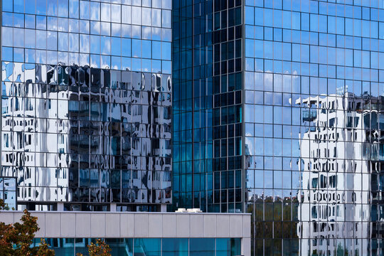 Reflex in the Skyscraper on the cloudy blue Sky