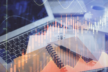 Double exposure of financial chart drawing and desktop with coffee and items on table background. Concept of forex market trading