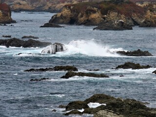 View of the Pacific Ocean and splashing water on the rocks