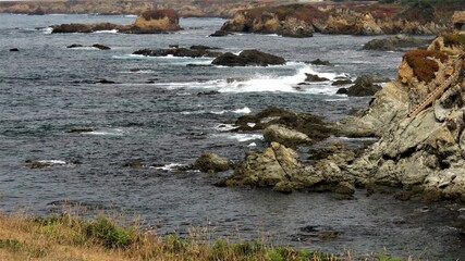 View of the Pacific Ocean and splashing water on the rocks