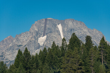 Fototapeta premium The Teton Range of the Rocky Mountains in North America. Jenny Lake Trail in Grand Teton National Park, Wyoming. USA. Back to Nature concept.
