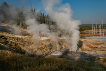 Hot Springs and gushing Geysers at Yellowstone National Park wilderness area atop a volcanic hot spot. USA.