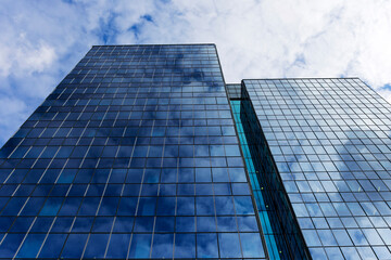 Reflex in the Skyscraper glass and metal on the cloudy Sky