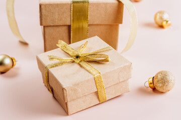 Fashion gifts or presents boxes with golden bows and balls Composition for Christmas.