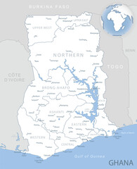 Blue-gray detailed map of Ghana administrative divisions and location on the globe.