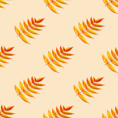 Seamless pattern. Red-yellow autumn leaves isolated on a yellow background