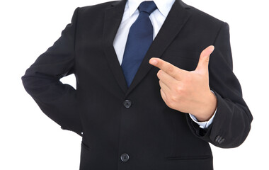 A man in a suit and leather shoes makes a sign language number 8 gesture