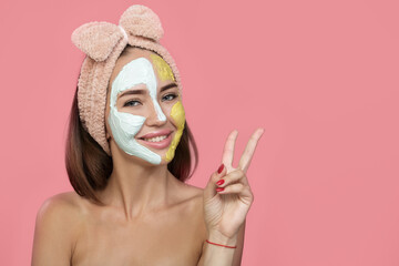 happy young girl smiling over pink background. Facial skin care concept