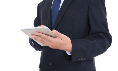Man in formal wear holding tablet in hand and standing in front of white background