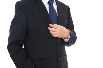 Man in suit and leather shoes standing in front of white background