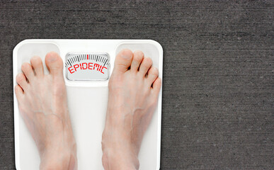 Obesity Epidemic Concept With Feet on Bathroom Scale Isolated With Copy Space