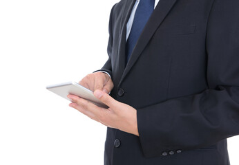 Close-up shot of a man in a black suit holding a tablet