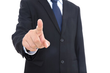 A man in a black formal suit and tie stretches out his index finger to make a click gesture in front of the camera