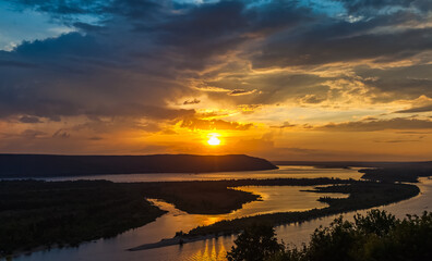 Obraz premium Landscape with sunset on the river in summer
