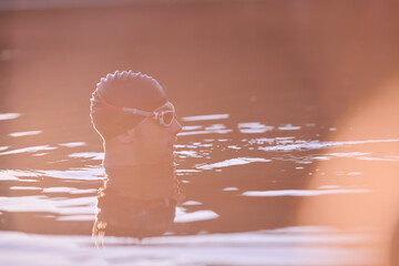 triathlete swimmer having a break during hard training