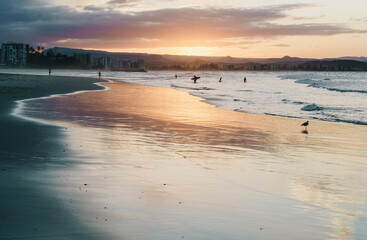 Snapper rocks and surfers.