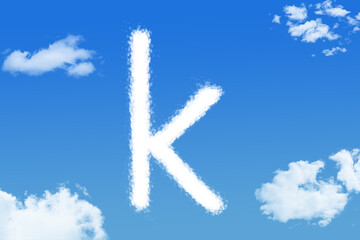 Naklejka premium Letter k cloud shape on blue sky