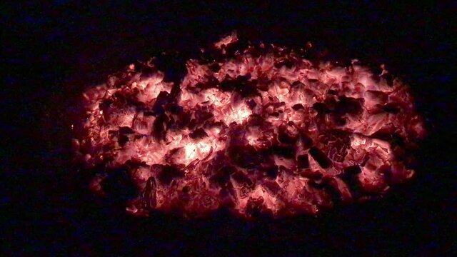 Firepit At Night Of Hot Coals After Firewood Burned Down