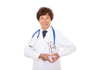 Fototapeta premium A doctor in a white coat stands in front of a white background and makes a love gesture with both hands
